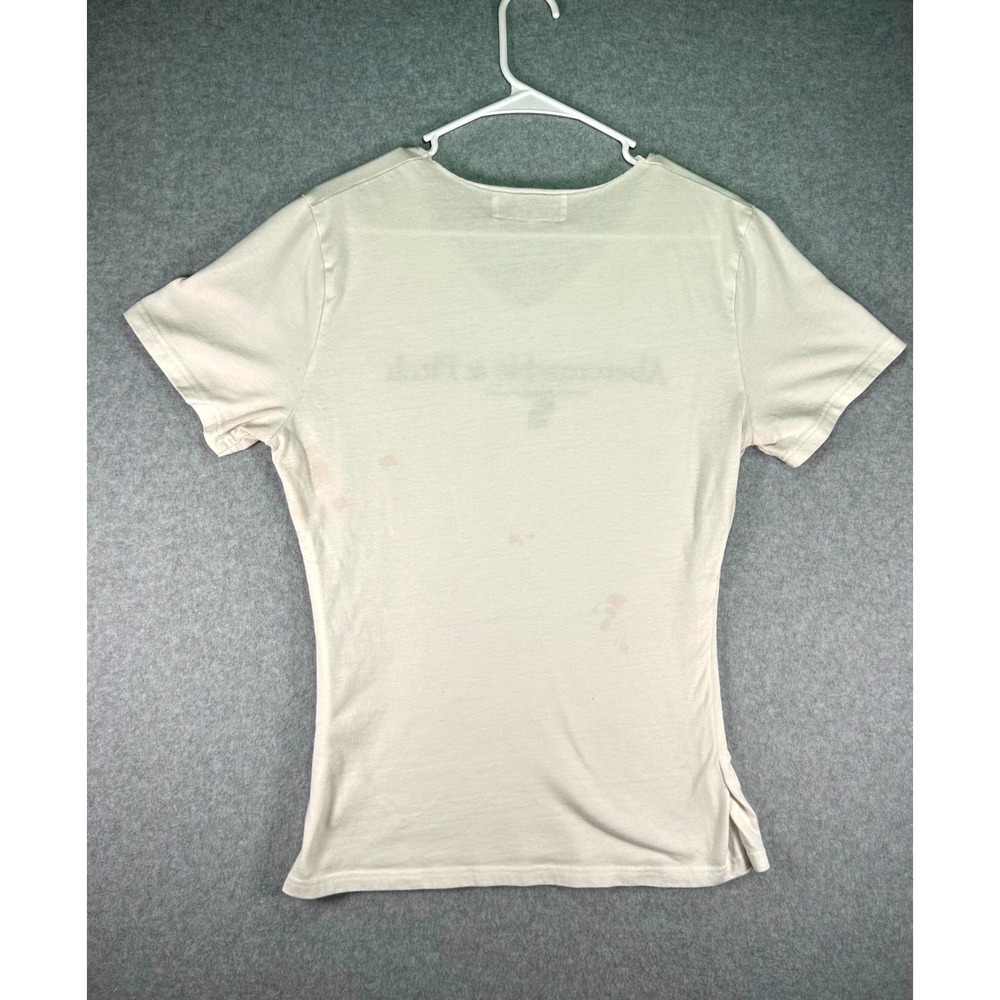 Stain* Abercrombie & Fitch T Shirt Womens M Beige Graphic Print V Neck - Picture 2 of 9